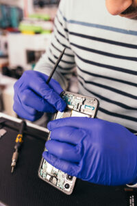 Image of technician repairing a phone screen