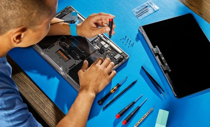 MacBook Pro being repaired on a workbench at iTech Norwich