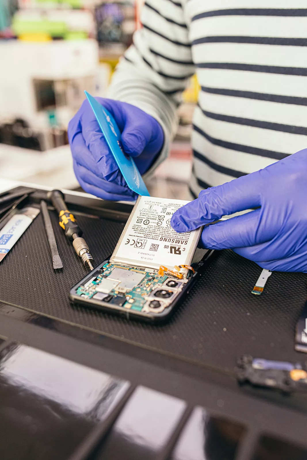 Samsung Galaxy phone being repaired on a workbench at iTech Norwich